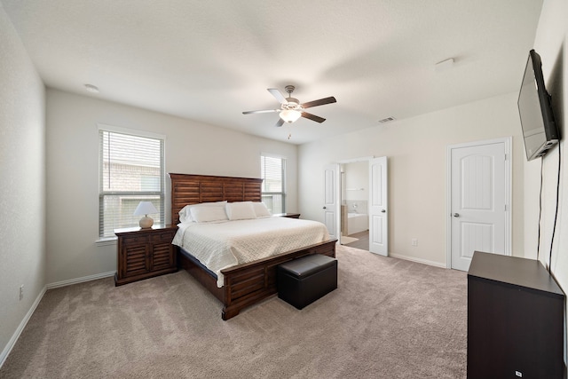 6406 Shadowbrook Hollow Trl, Katy, TX 77493 - bedroom featuring light colored carpet, ensuite bathroom, and a ceiling fan