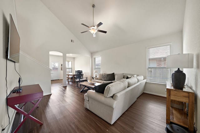 6406 Shadowbrook Hollow Trl, Katy, TX 77493 - living room featuring ceiling fan, healthy amount of natural light, arched walkways, dark wood finished floors, and high vaulted ceiling