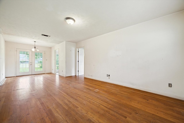 8510 Montridge Dr, Houston, TX 77055 - empty room with wood finished floors and a chandelier