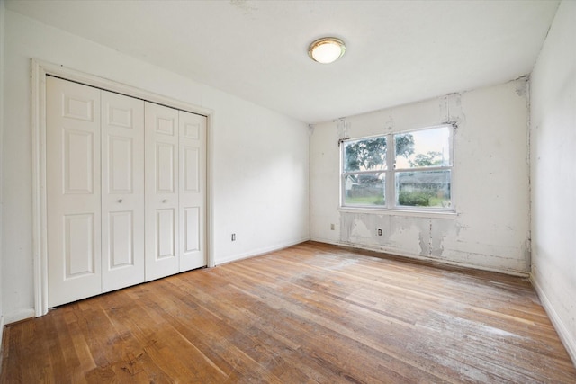 8510 Montridge Dr, Houston, TX 77055 - unfurnished bedroom with hardwood / wood-style flooring and a closet