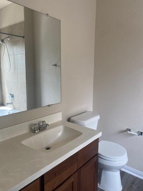 16707 Libson Falls Dr, Houston, TX 77095 - full bath featuring vanity, wood finished floors, and bathtub / shower combination