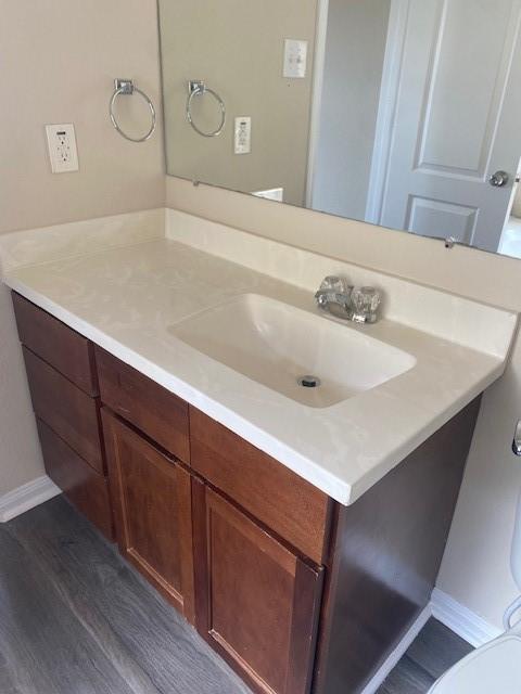16707 Libson Falls Dr, Houston, TX 77095 - bathroom with vanity and wood finished floors