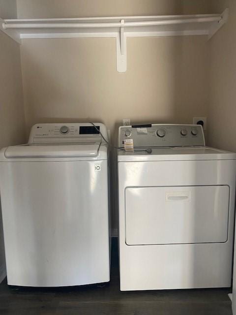 16707 Libson Falls Dr, Houston, TX 77095 - laundry area with washing machine and clothes dryer and wood finished floors