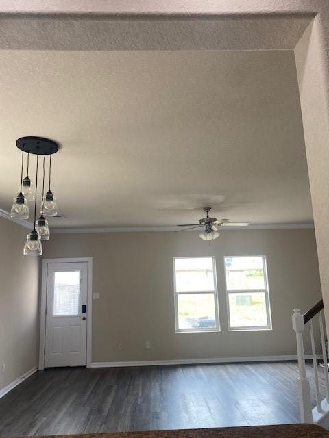 16707 Libson Falls Dr, Houston, TX 77095 - entryway with dark wood-type flooring, ornamental molding, and ceiling fan