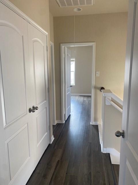 16707 Libson Falls Dr, Houston, TX 77095 - corridor with attic access, dark wood-type flooring, and an upstairs landing