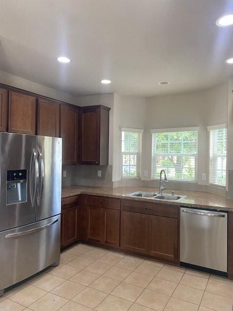 16707 Libson Falls Dr, Houston, TX 77095 - kitchen with appliances with stainless steel finishes, light tile patterned floors, and recessed lighting