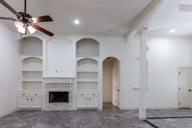 104 Drexal Dr, Huntsville, TX 77340 - unfurnished living room with built in shelves, ceiling fan, ornamental molding, a stone fireplace, and marble finish floors