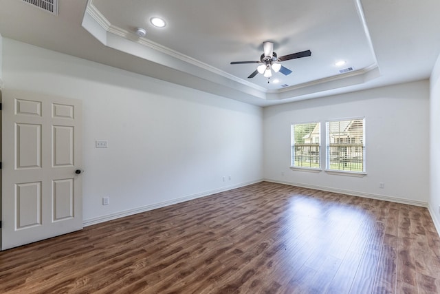 104 Drexal Dr, Huntsville, TX 77340 - unfurnished room with a raised ceiling, ornamental molding, dark wood-style floors, a ceiling fan, and recessed lighting