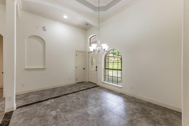104 Drexal Dr, Huntsville, TX 77340 - entrance foyer featuring ornamental molding, a chandelier, a high ceiling, marble finish floors, and recessed lighting