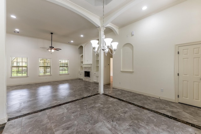 104 Drexal Dr, Huntsville, TX 77340 - unfurnished living room with ornamental molding, a ceiling fan, recessed lighting, inlaid floor details, and arched walkways