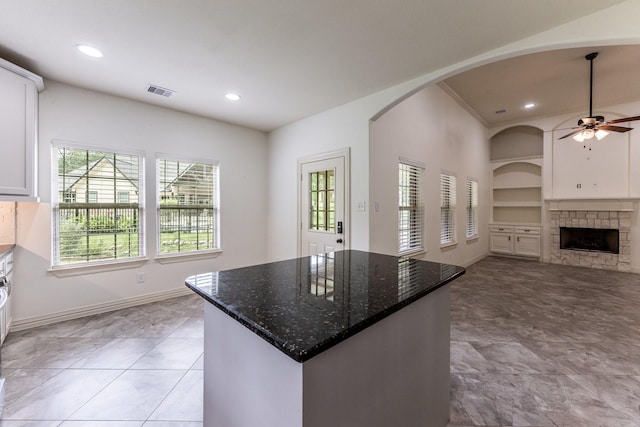 104 Drexal Dr, Huntsville, TX 77340 - kitchen with a ceiling fan, plenty of natural light, open floor plan, built in shelves, and recessed lighting