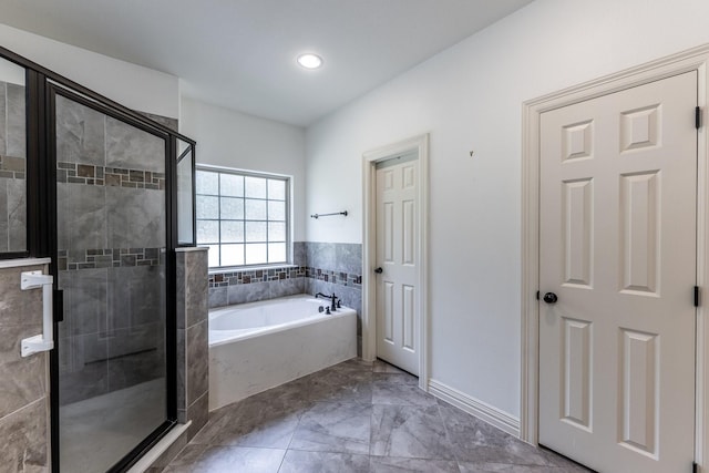 104 Drexal Dr, Huntsville, TX 77340 - bathroom featuring a bath, a stall shower, marble finish floors, and recessed lighting