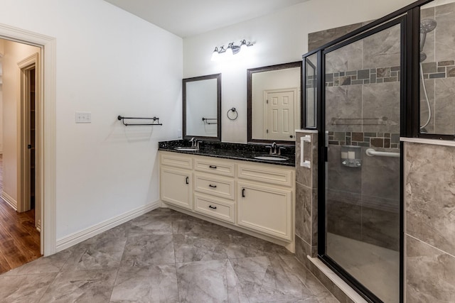 104 Drexal Dr, Huntsville, TX 77340 - bathroom featuring double vanity and a shower stall