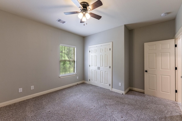 104 Drexal Dr, Huntsville, TX 77340 - unfurnished bedroom with carpet floors, a closet, and a ceiling fan