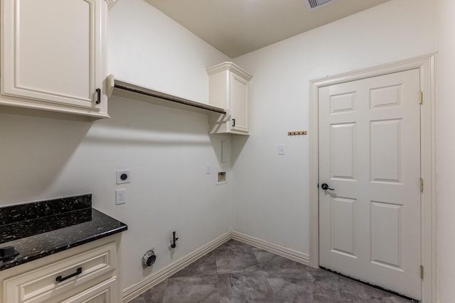 104 Drexal Dr, Huntsville, TX 77340 - washroom with dark marble finish flooring, gas dryer hookup, hookup for an electric dryer, washer hookup, and cabinet space