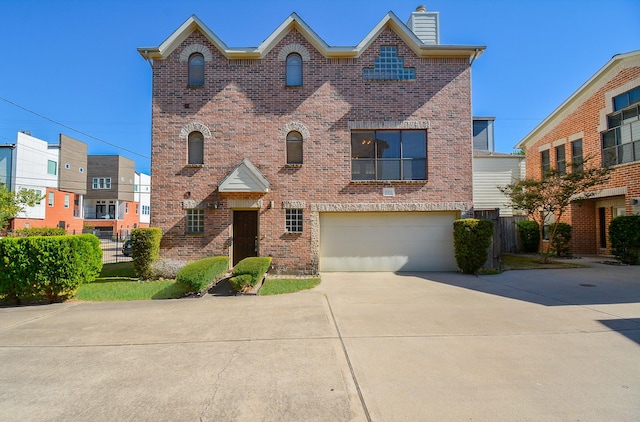9703 Riddlewood Ln, Houston, TX 77025 - view of front facade featuring brick siding, concrete driveway, an attached garage, and a chimney