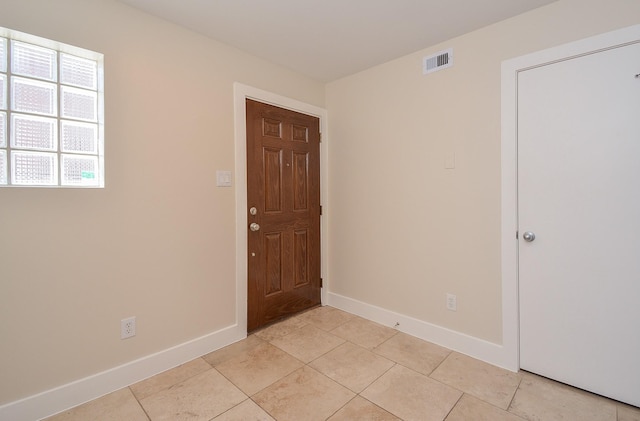 9703 Riddlewood Ln, Houston, TX 77025 - entrance foyer featuring baseboards and light tile patterned floors