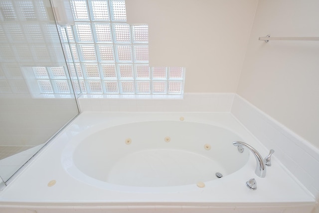 9703 Riddlewood Ln, Houston, TX 77025 - bathroom with a tub with jets