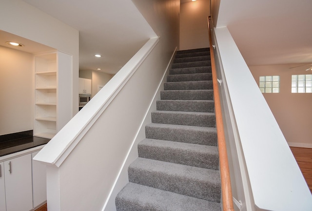 9703 Riddlewood Ln, Houston, TX 77025 - stairs featuring a ceiling fan and recessed lighting