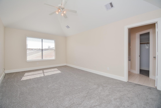 9703 Riddlewood Ln, Houston, TX 77025 - empty room featuring carpet, ceiling fan, and vaulted ceiling