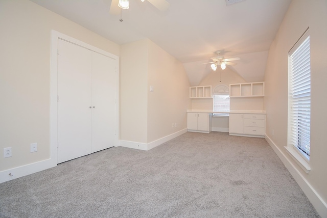 9703 Riddlewood Ln, Houston, TX 77025 - unfurnished living room with ceiling fan, light colored carpet, and vaulted ceiling