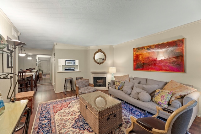 4643 Wild Indigo St Unit 416, Houston, TX 77027 - living area with hardwood / wood-style flooring, crown molding, and a fireplace