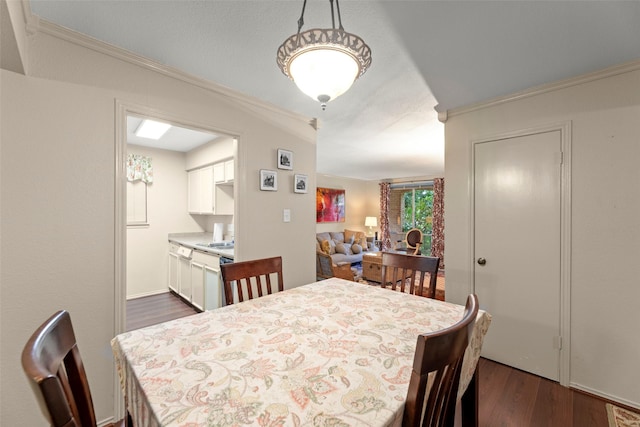 4643 Wild Indigo St Unit 416, Houston, TX 77027 - dining room with dark wood finished floors and ornamental molding