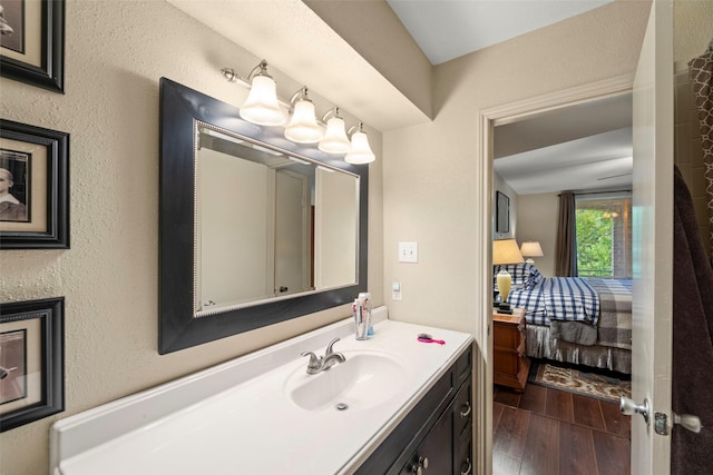 4643 Wild Indigo St Unit 416, Houston, TX 77027 - ensuite bathroom with vanity and wood finished floors