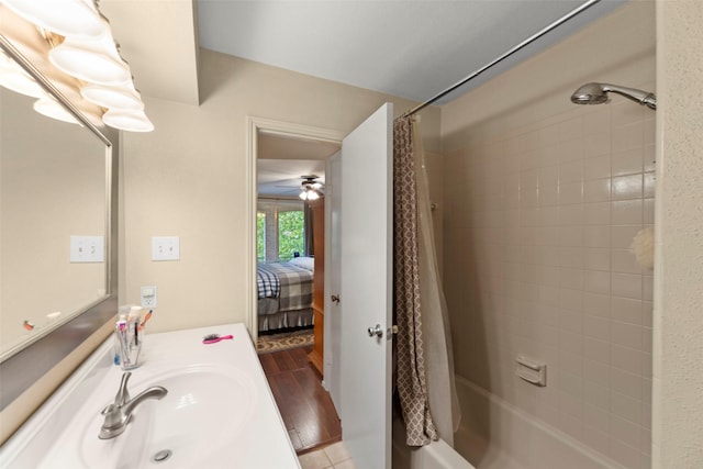 4643 Wild Indigo St Unit 416, Houston, TX 77027 - ensuite bathroom featuring shower / bath combo with shower curtain, vanity, a ceiling fan, and wood finished floors