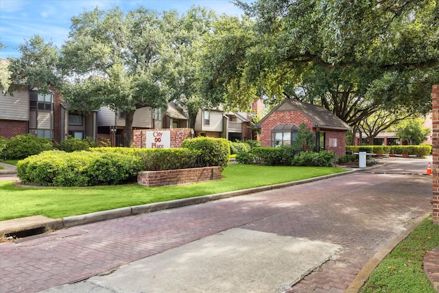 7447 Cambridge St Unit 15, Houston, TX 77054 - view of front of property featuring brick siding and a front lawn
