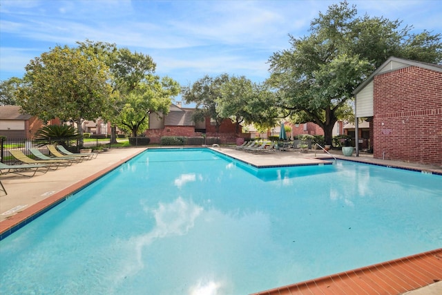 7447 Cambridge St Unit 15, Houston, TX 77054 - community pool with a patio area and a residential view