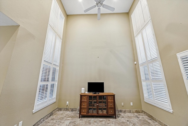 7447 Cambridge St Unit 15, Houston, TX 77054 - home office with healthy amount of natural light, a ceiling fan, and a high ceiling