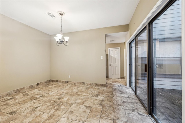 7447 Cambridge St Unit 15, Houston, TX 77054 - unfurnished room with a chandelier and light stone finish floors
