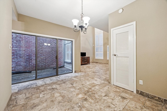 7447 Cambridge St Unit 15, Houston, TX 77054 - unfurnished room with a chandelier, a smoke detector, and stone finish floors