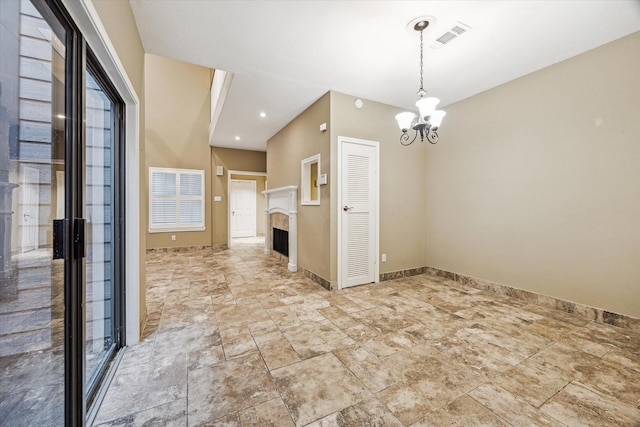 7447 Cambridge St Unit 15, Houston, TX 77054 - empty room with a chandelier and a fireplace