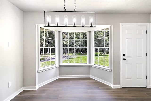 387 Hackberry Dr, Onalaska, TX 77360 - unfurnished dining area with dark wood-style floors