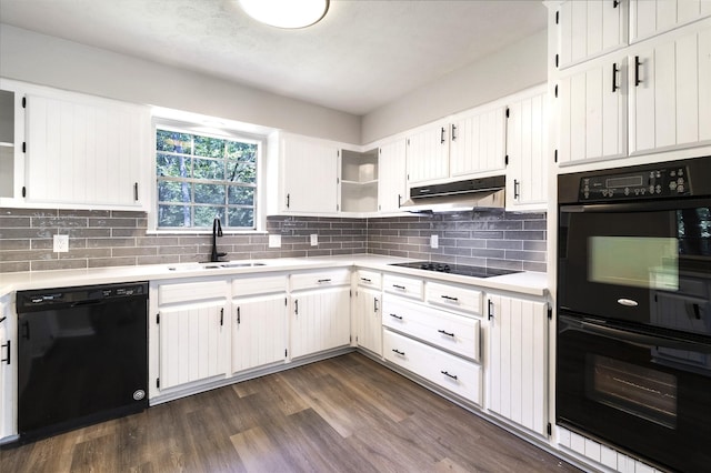 387 Hackberry Dr, Onalaska, TX 77360 - kitchen with black appliances, under cabinet range hood, open shelves, and light countertops