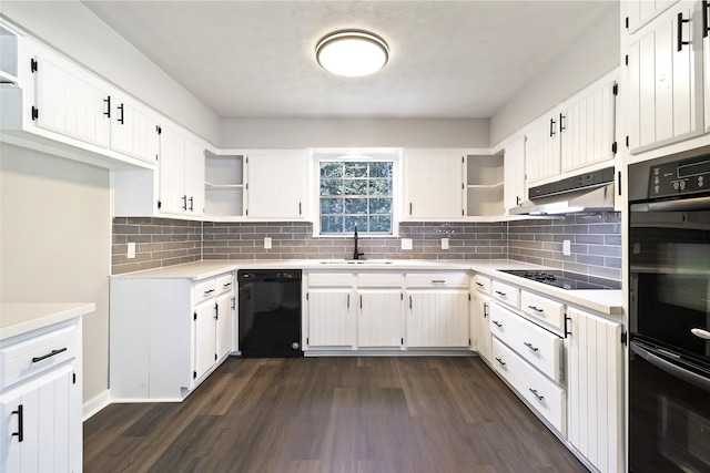 387 Hackberry Dr, Onalaska, TX 77360 - kitchen with black appliances, open shelves, dark wood-style floors, and under cabinet range hood