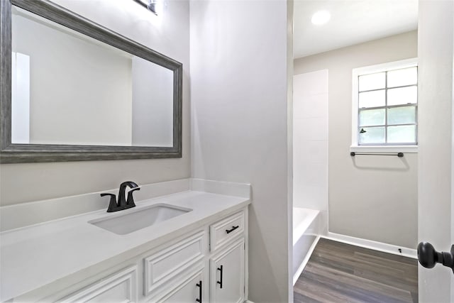 387 Hackberry Dr, Onalaska, TX 77360 - full bathroom with vanity, wood finished floors, and recessed lighting