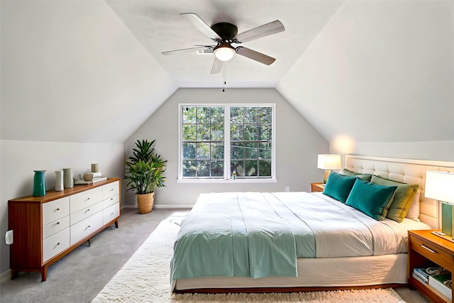 387 Hackberry Dr, Onalaska, TX 77360 - bedroom featuring light carpet, lofted ceiling, and a ceiling fan