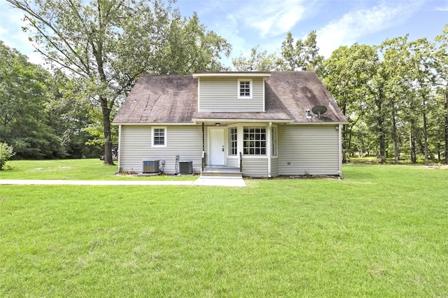 387 Hackberry Dr, Onalaska, TX 77360 - view of front of home with a front yard and roof with shingles