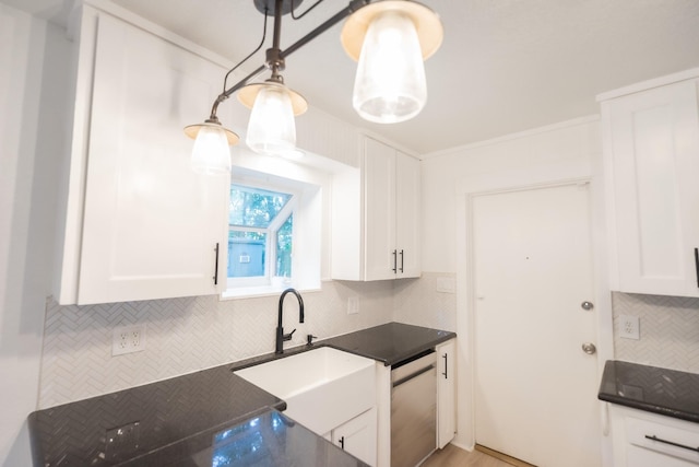 1025 Hathaway Ln, Marque, TX 77568 - kitchen featuring dishwasher, tasteful backsplash, white cabinets, and decorative light fixtures