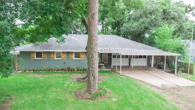 1025 Hathaway Ln, Marque, TX 77568 - view of front facade featuring concrete driveway, brick siding, an attached garage, a carport, and a shingled roof