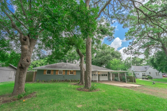 1025 Hathaway Ln, Marque, TX 77568 - view of front of house with driveway, an attached garage, an attached carport, and brick siding