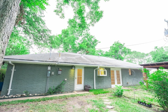1025 Hathaway Ln, Marque, TX 77568 - ranch-style house with french doors and brick siding