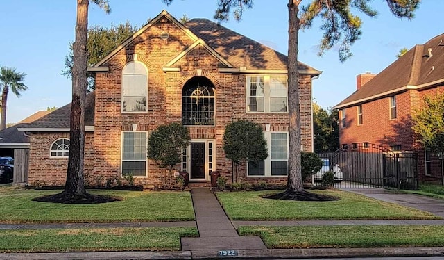 7922 Scenic Canyon Ln W, Houston, TX 77095 - view of front of property with brick siding, a gate, and driveway