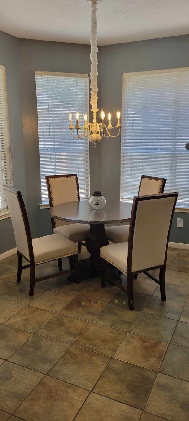 7922 Scenic Canyon Ln W, Houston, TX 77095 - dining room featuring a chandelier and tile patterned flooring