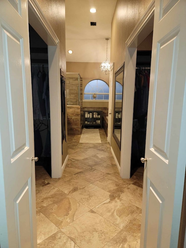 7922 Scenic Canyon Ln W, Houston, TX 77095 - hall with a chandelier, light stone finish floors, and recessed lighting