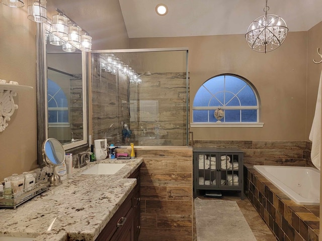 7922 Scenic Canyon Ln W, Houston, TX 77095 - full bathroom with vanity, a tub with jets, a tile shower, a chandelier, and recessed lighting