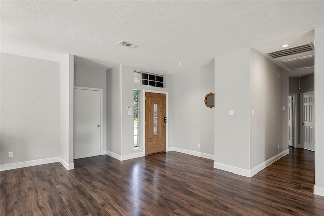 23826 Spring Dane Dr, Spring, TX 77373 - foyer entrance with dark wood-style flooring, a textured ceiling, and recessed lighting